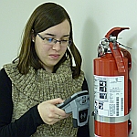inspecting a fire extinguisher